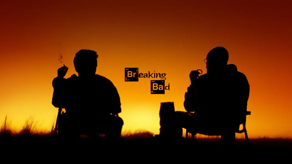 Two silhouetted figures beneath an amber sky in Breaking Bad.